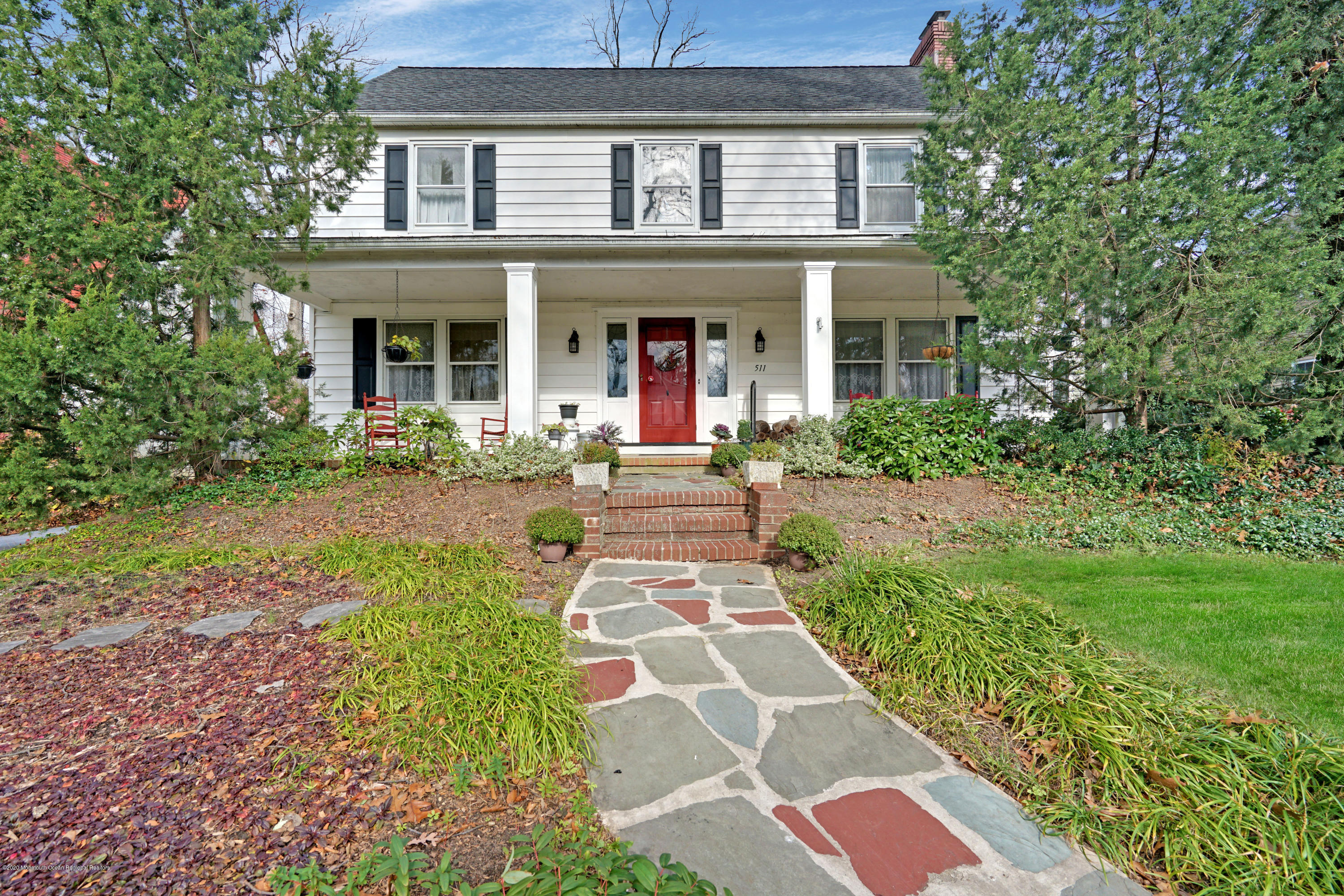 511 Wildwood Road West Allenhurst, NJ 07711 - Photo 19 of 39 front view of a house with a yard