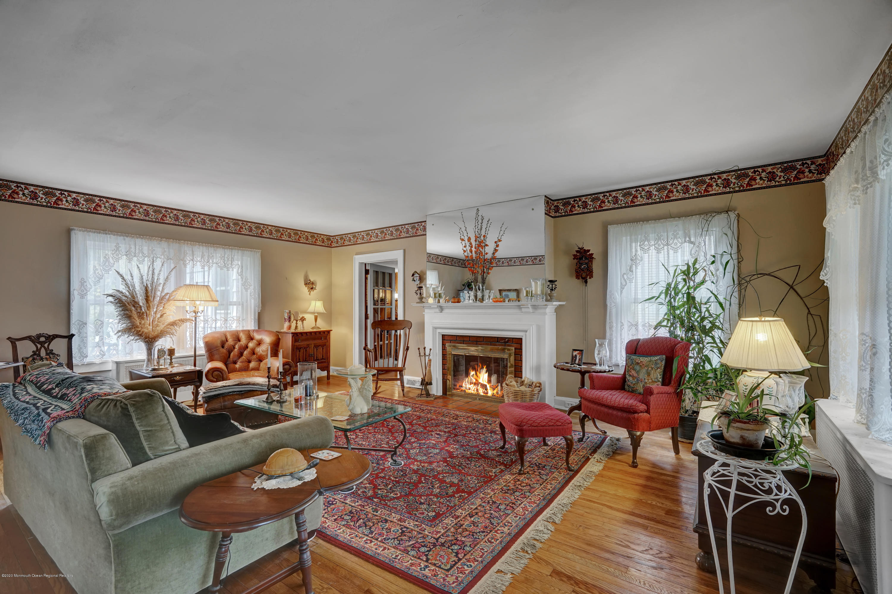 511 Wildwood Road West Allenhurst, NJ 07711 - Photo 3 of 39 a living room with furniture and a fireplace