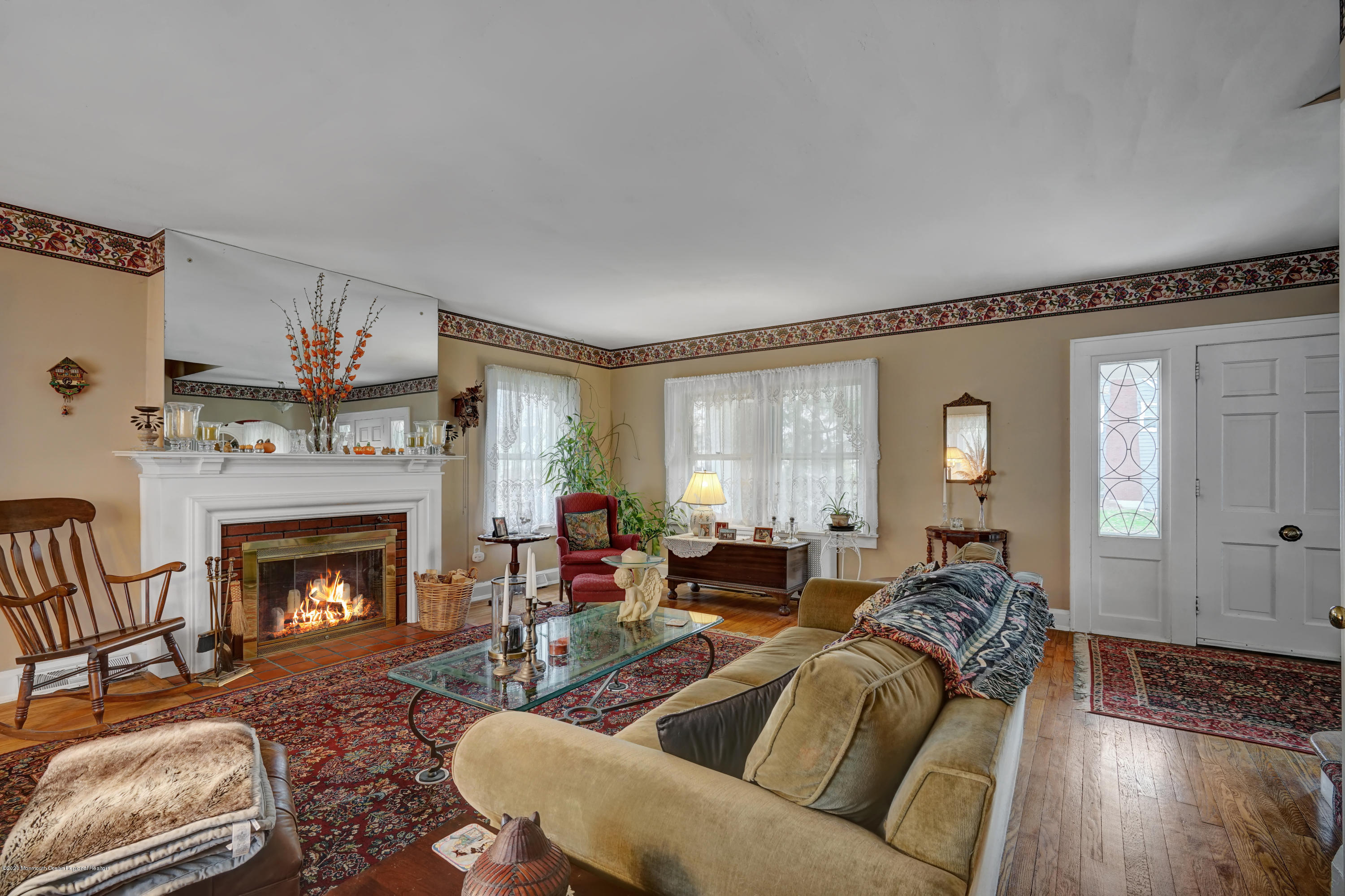 511 Wildwood Road West Allenhurst, NJ 07711 - Photo 21 of 39 a living room with furniture and a fireplace