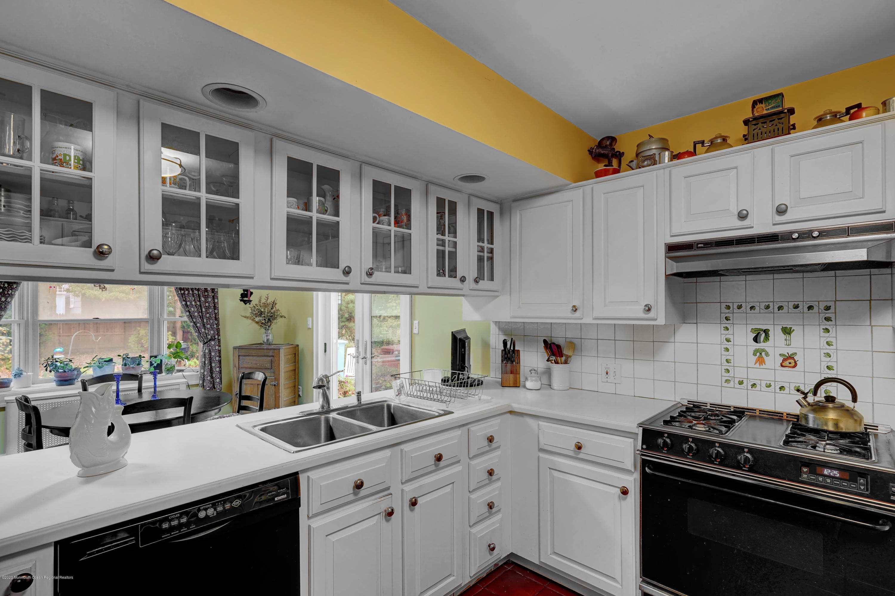 511 Wildwood Road West Allenhurst, NJ 07711 - Photo 23 of 39 a kitchen with stainless steel appliances a stove a sink and cabinets