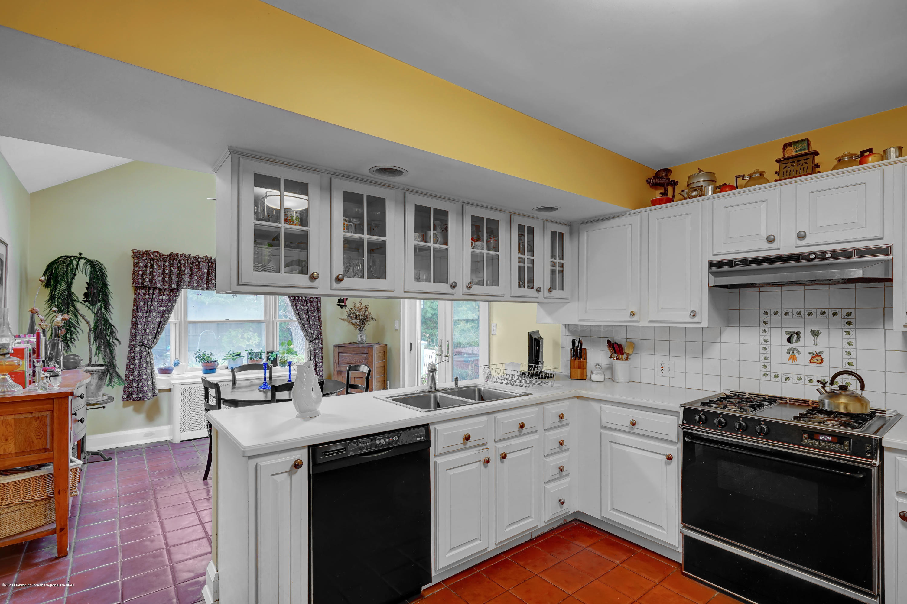 511 Wildwood Road West Allenhurst, NJ 07711 - Photo 25 of 39 a kitchen with stainless steel appliances granite countertop a sink stove and cabinets