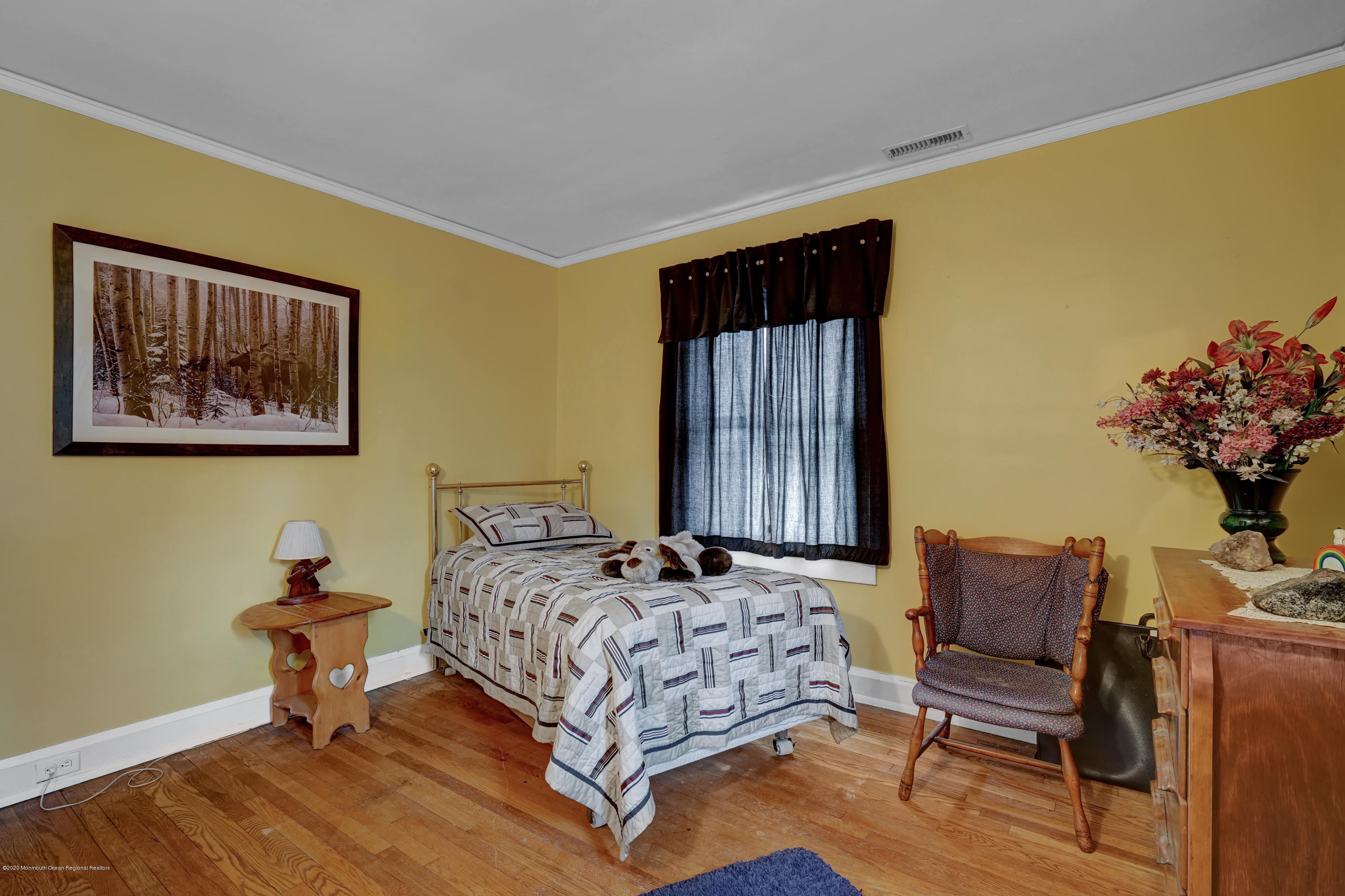 511 Wildwood Road West Allenhurst, NJ 07711 - Photo 31 of 39 a bedroom with a bed and a chair