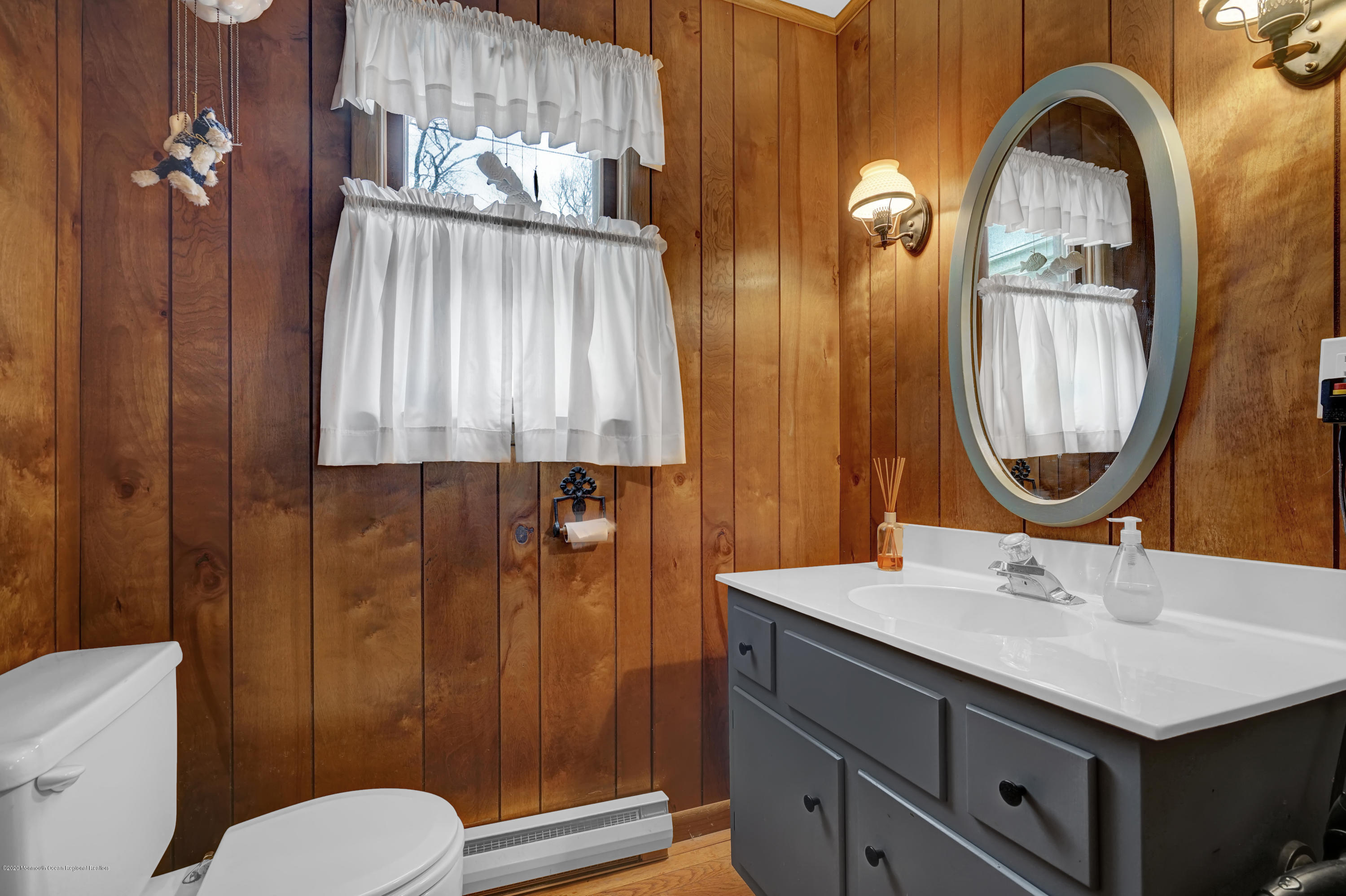 511 Wildwood Road West Allenhurst, NJ 07711 - Photo 33 of 39 a bathroom with a sink a toilet and shower