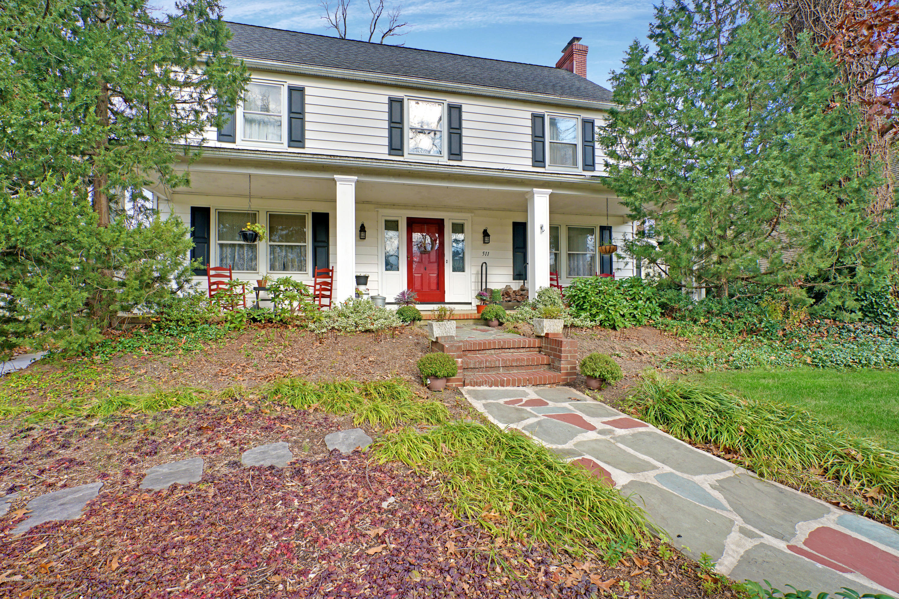 511 Wildwood Road West Allenhurst, NJ 07711 - Photo 36 of 39 a front view of a house with garden and porch