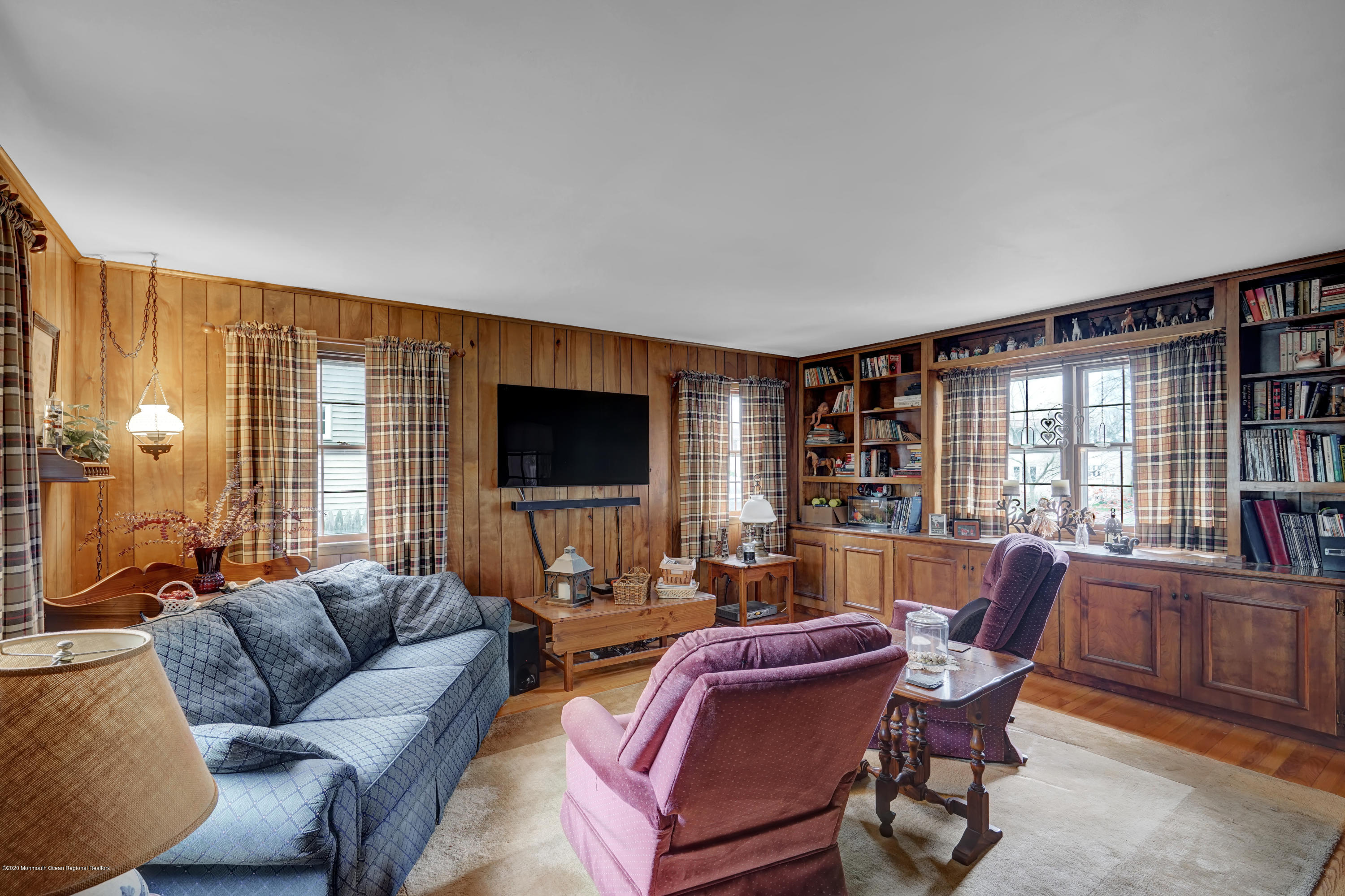 511 Wildwood Road West Allenhurst, NJ 07711 - Photo 7 of 39 a living room with furniture a flat screen tv and a large window