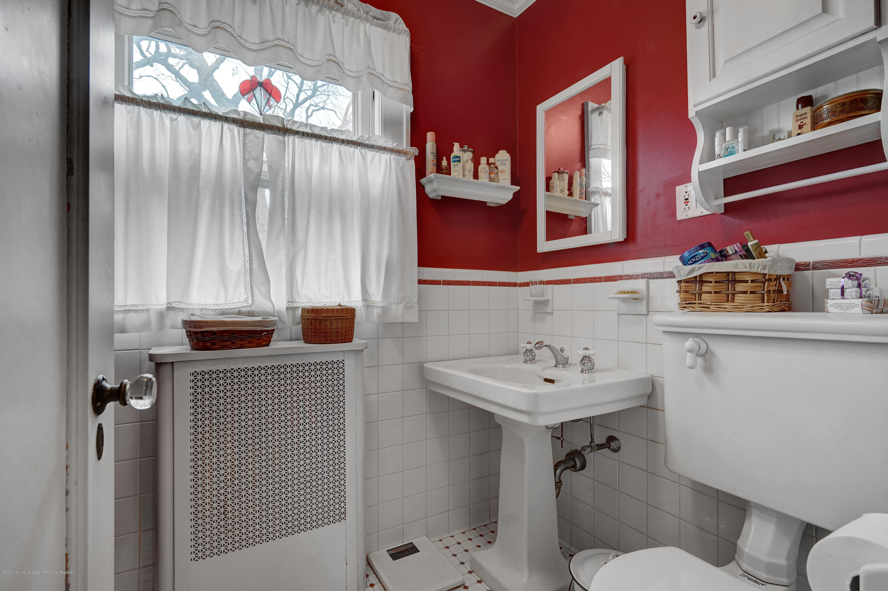 511 Wildwood Road West Allenhurst, NJ 07711 - Photo 9 of 39 a bathroom with a sink a toilet and a mirror