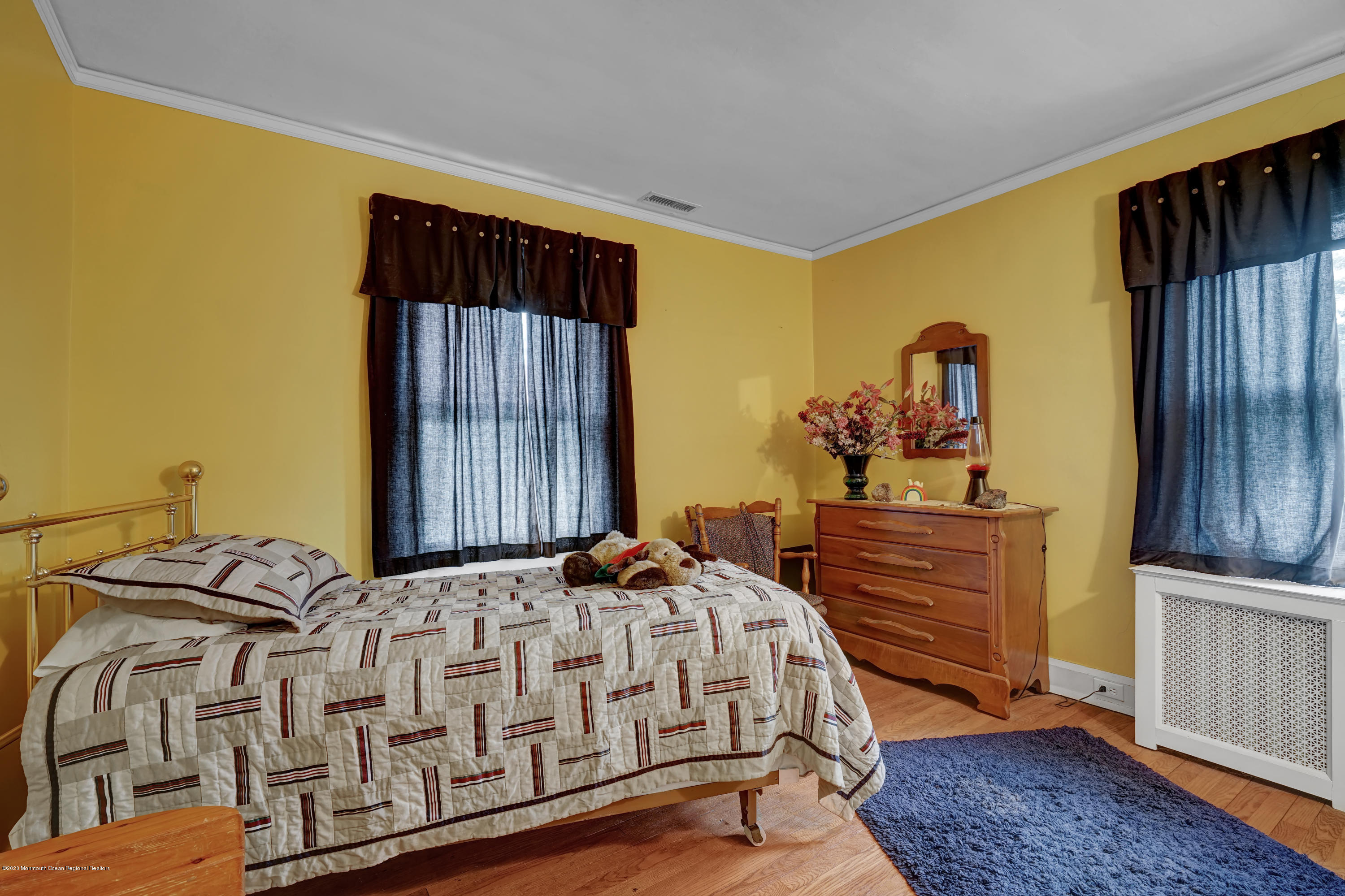 511 Wildwood Road West Allenhurst, NJ 07711 - Photo 10 of 39 a bedroom with a bed and wooden floor