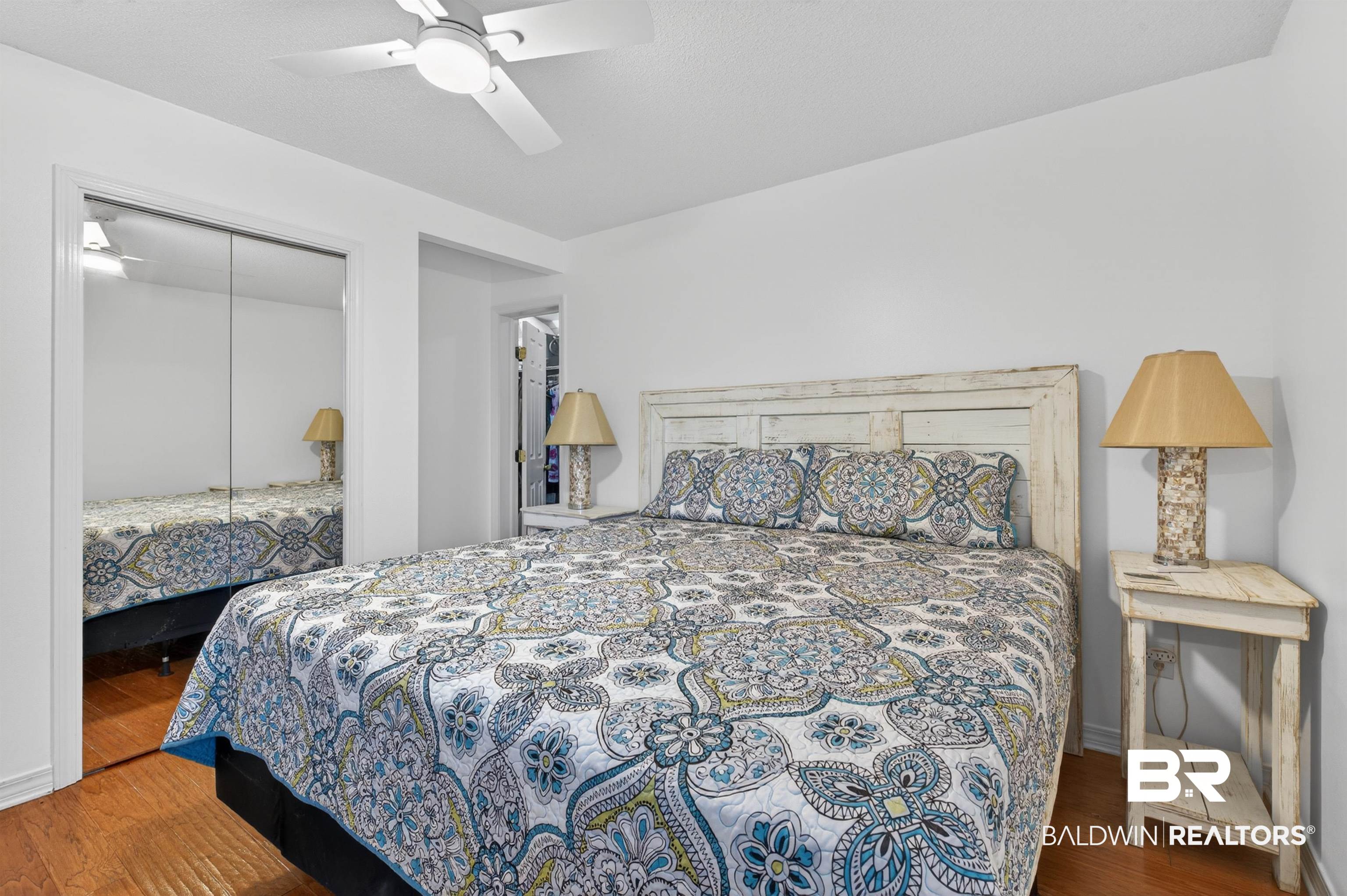 9624 North Bay Street Foley, AL 36535 - Photo 21 of 59 Bedroom featuring wood-finish flooring and a white ceiling fan