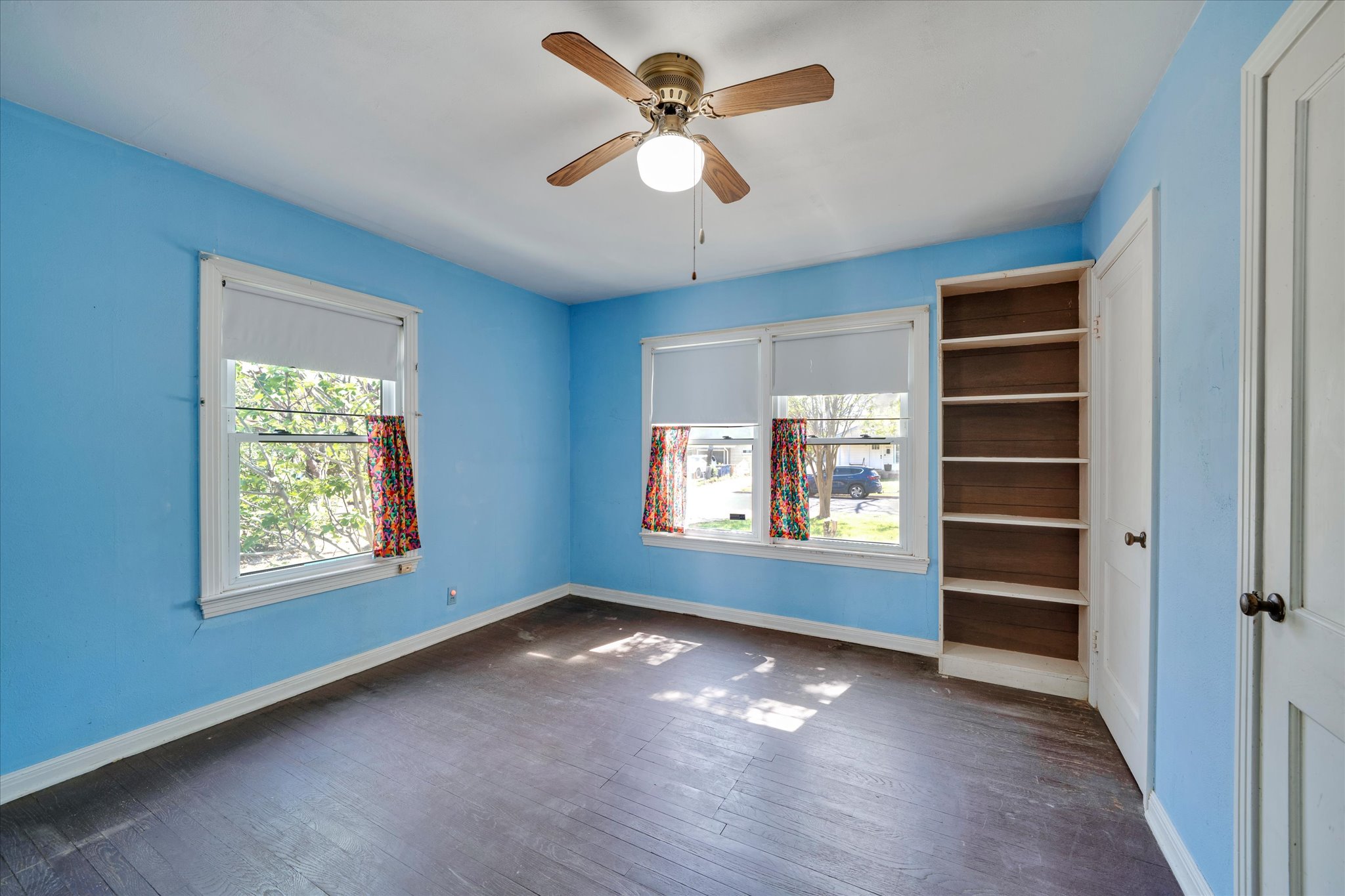 1206 Ruth Avenue Austin, TX 78757 - Photo 12 of 38 a view of an empty room with a window and a kitchen
