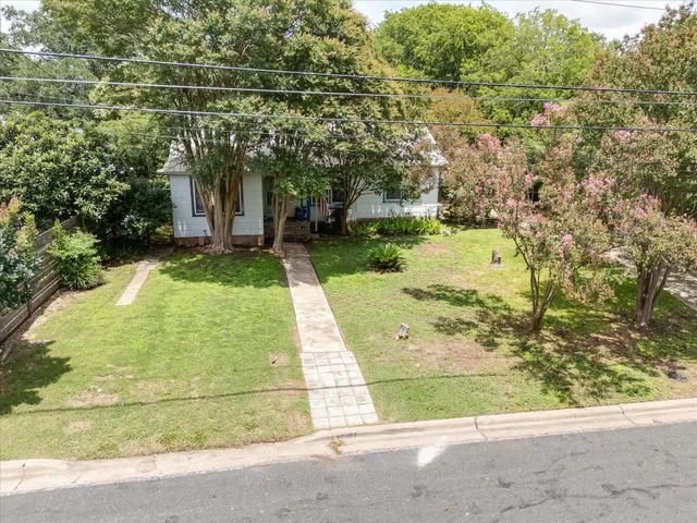 a view of a yard with an outdoor seating