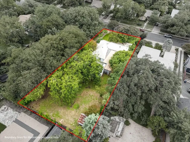 an aerial view of residential house with outdoor space