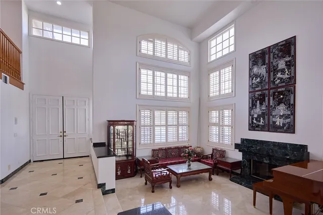 a living room with furniture couches and a flat tv screen