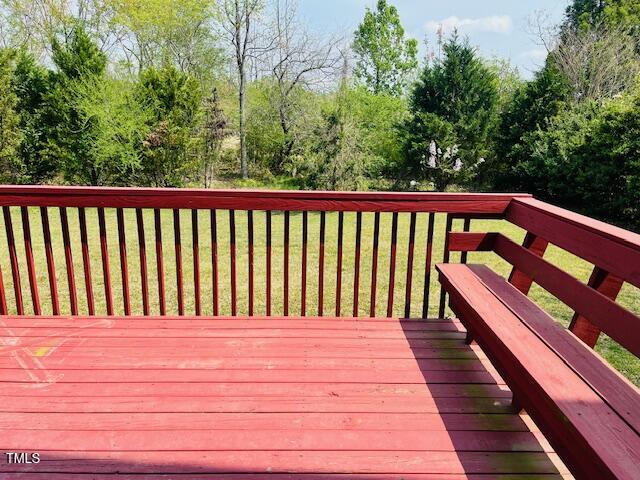 151 Bear Oak Drive Smithfield, NC 27577 - Photo 16 of 16 a balcony with view of trees in the background