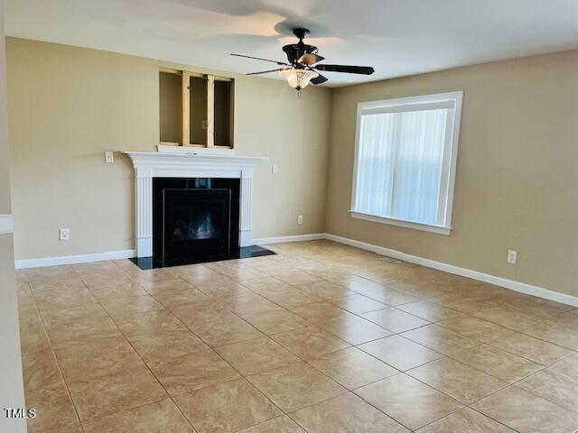 151 Bear Oak Drive Smithfield, NC 27577 - Photo 3 of 16 a view of an empty room with chandelier fan and fire place