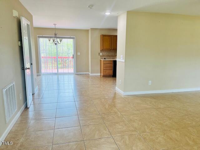 151 Bear Oak Drive Smithfield, NC 27577 - Photo 4 of 16 a view of a kitchen with a sink and a refrigerator