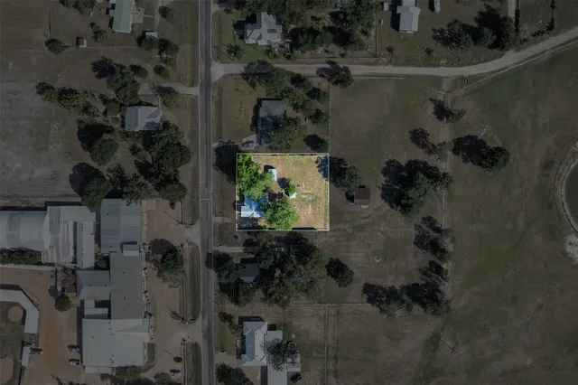 an aerial view of residential house with outdoor space