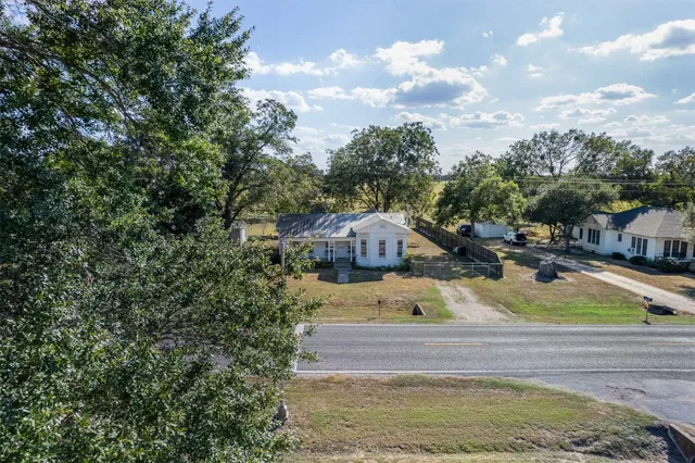 a view of yard with swimming pool and seating area