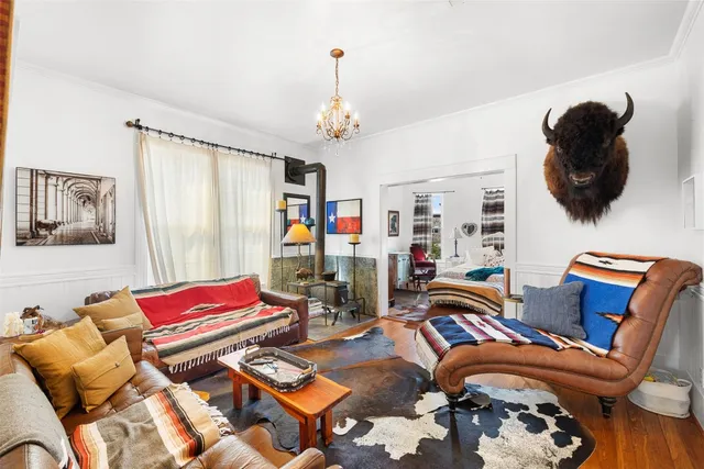 a bedroom with furniture or couch and a flat screen tv