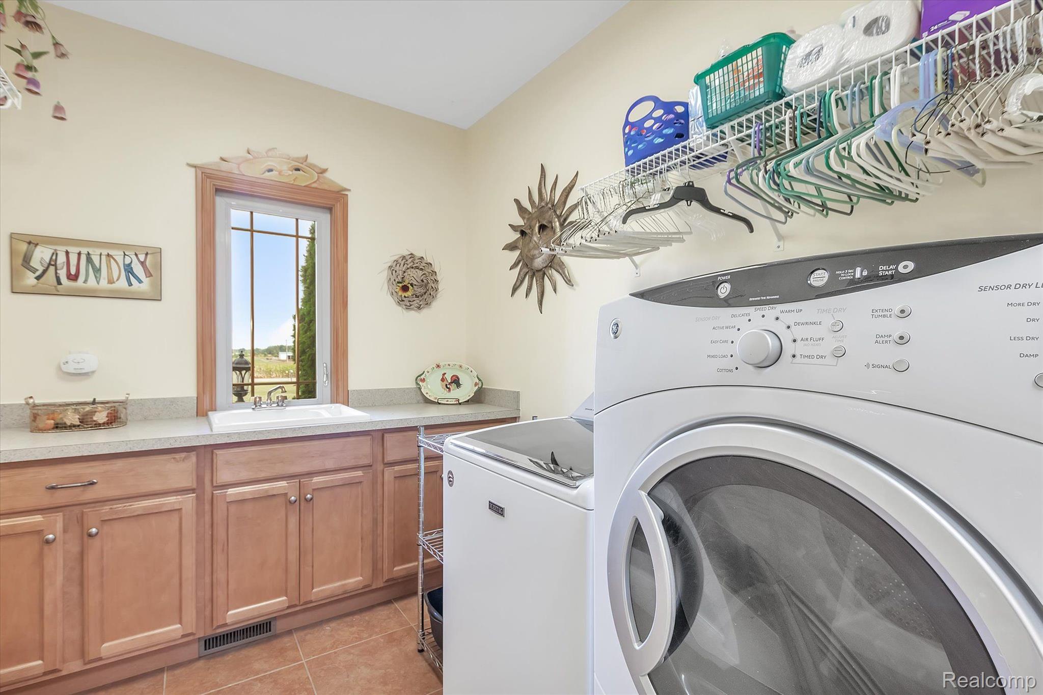 2269 West Sigler Road Carleton, MI 48117 - Photo 19 of 59 15x7 Laundry room with cabinets and counter space