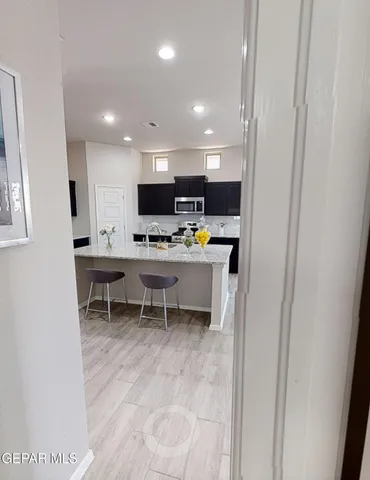 a kitchen with a sink cabinets and window