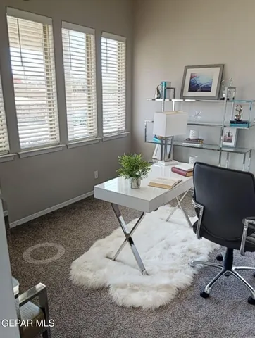 a view of a livingroom with furniture