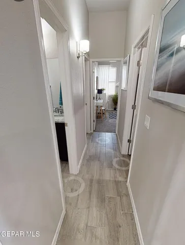 a view of a kitchen from a hallway