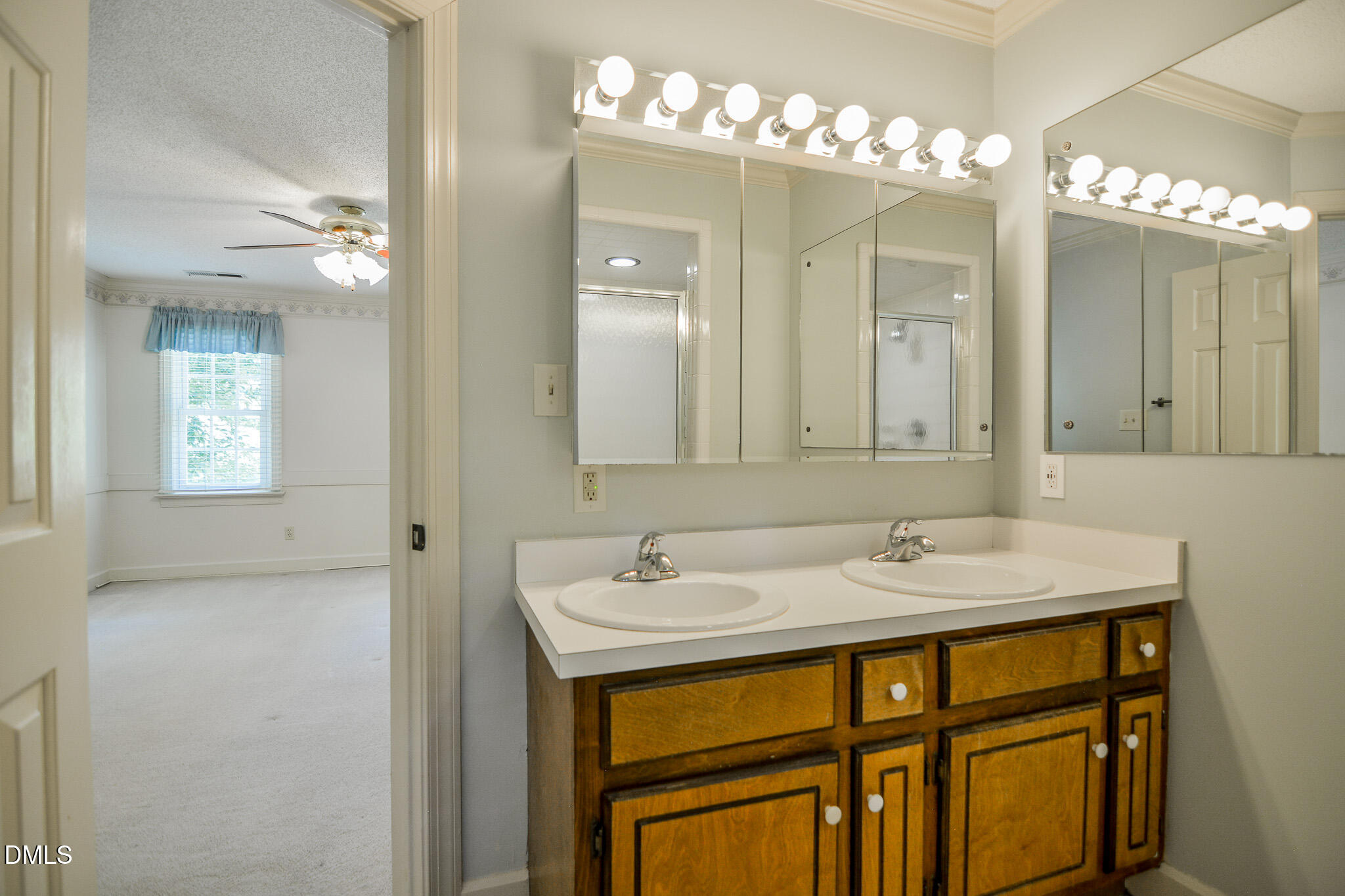 1215 Cambridge Road Northwest Wilson, NC 27896 - Photo 43 of 54 a bathroom with a sink double vanity and a mirror