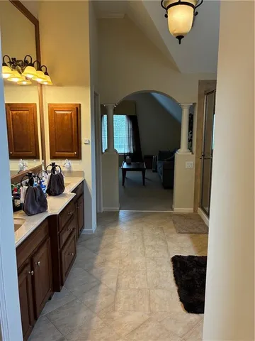 a bathroom with a sink a mirror and a bathtub