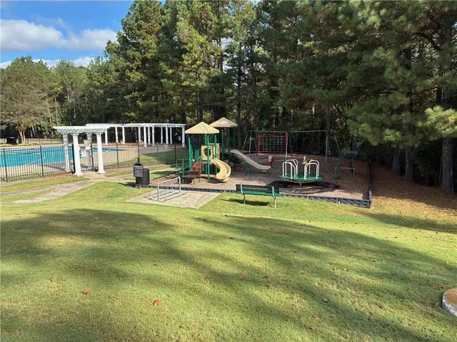 a house view with a sitting space and garden