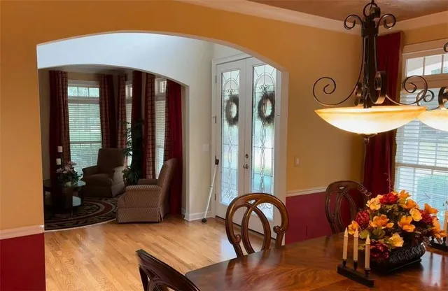 a view of a livingroom with furniture and entryway