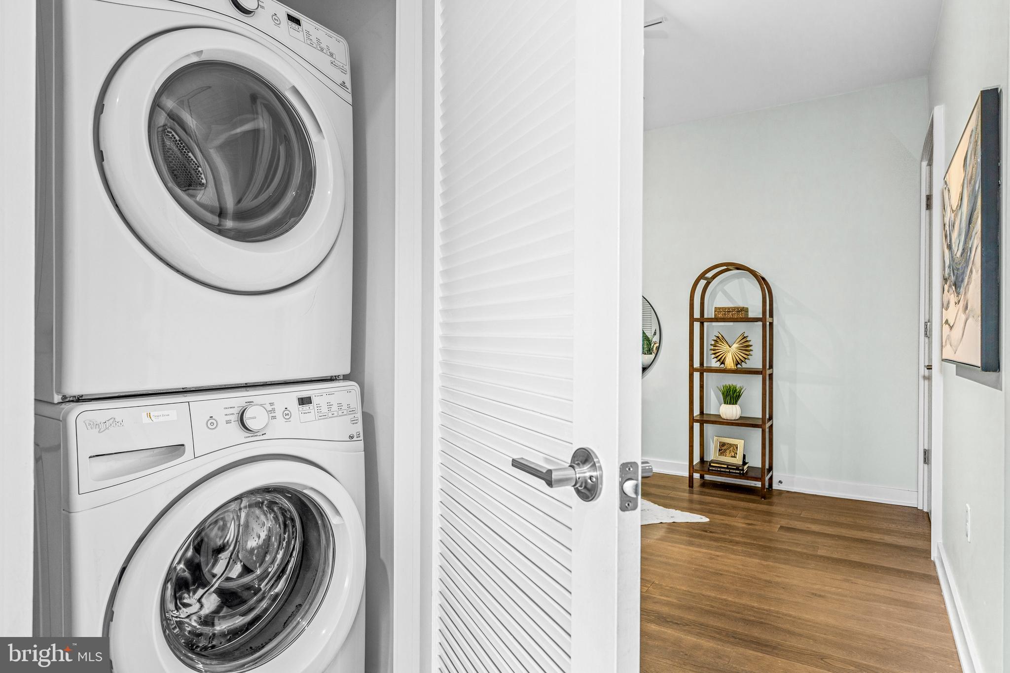 1380 Quincy Street Northwest, Unit 3E Washington, DC 20010 - Photo 21 of 42 a view of a hallway with washer and dryer