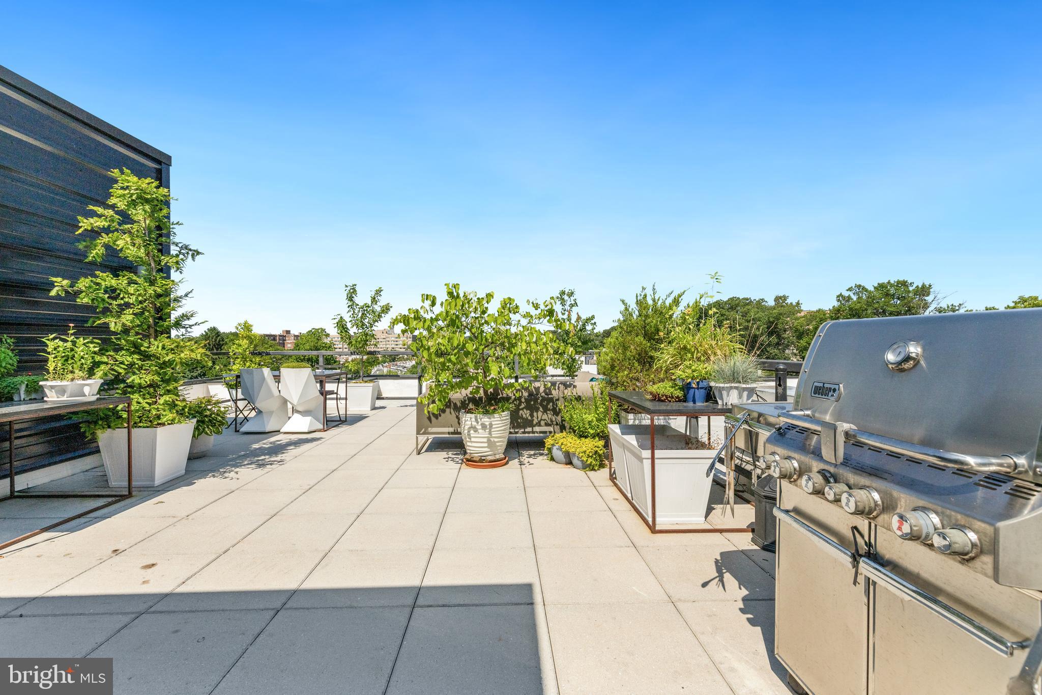 1380 Quincy Street Northwest, Unit 3E Washington, DC 20010 - Photo 24 of 42 a view of a terrace with furniture and a garden