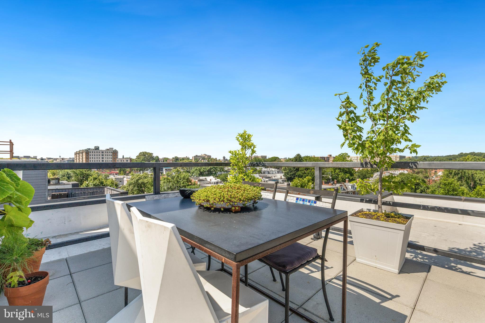 1380 Quincy Street Northwest, Unit 3E Washington, DC 20010 - Photo 27 of 42 a view of a terrace with furniture and city view