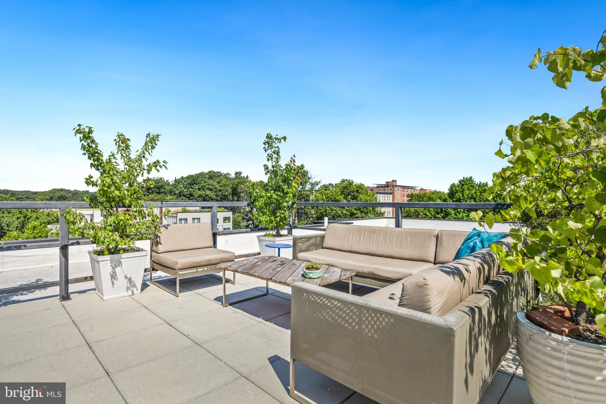 1380 Quincy Street Northwest, Unit 3E Washington, DC 20010 - Photo 29 of 42 a view of a patio with couches and potted plants