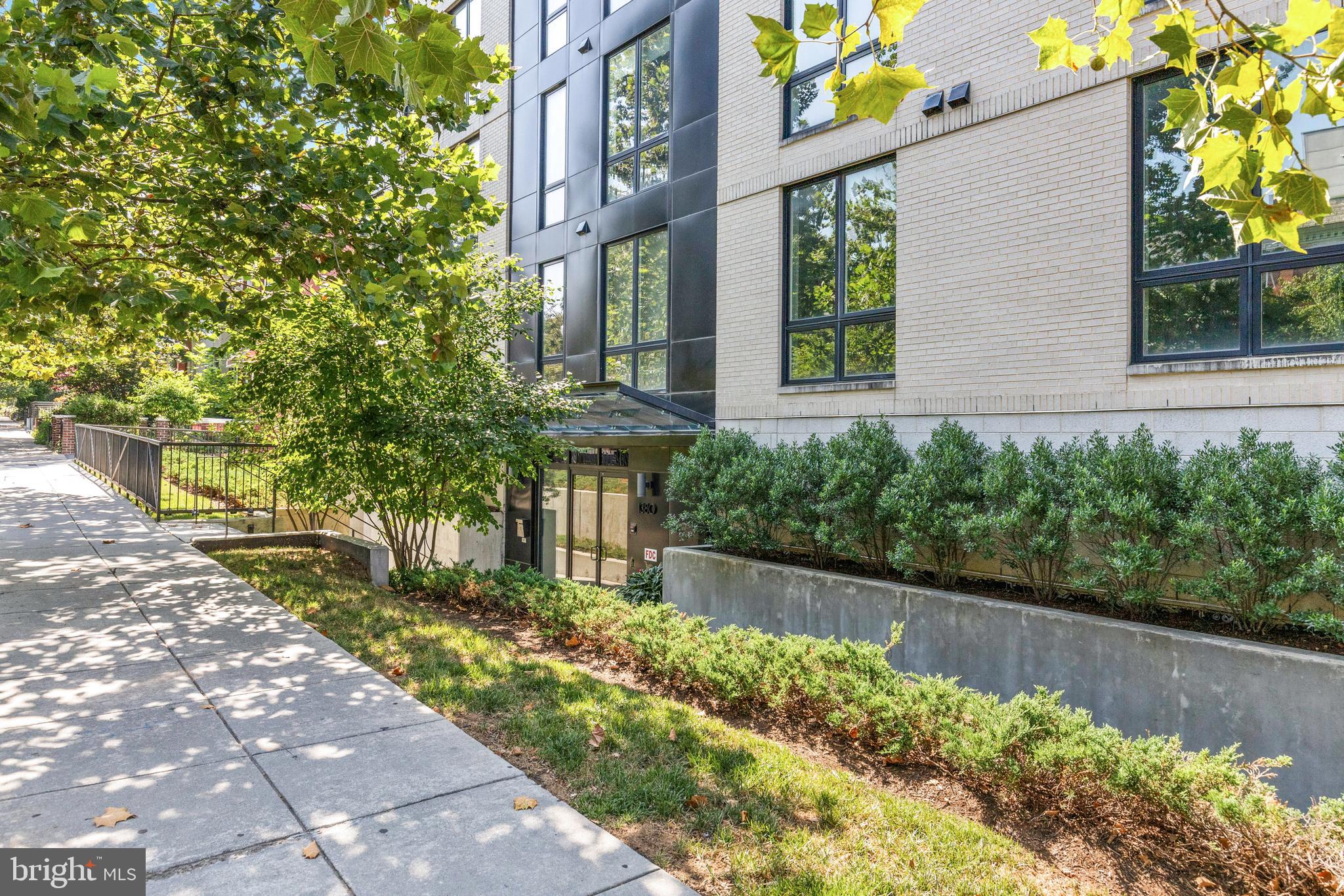 1380 Quincy Street Northwest, Unit 3E Washington, DC 20010 - Photo 31 of 42 a front view of a house with a yard