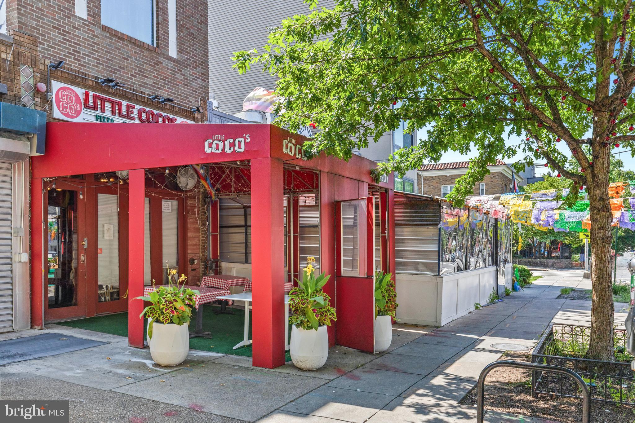 1380 Quincy Street Northwest, Unit 3E Washington, DC 20010 - Photo 42 of 42 a front view of a multi story building with retail shops