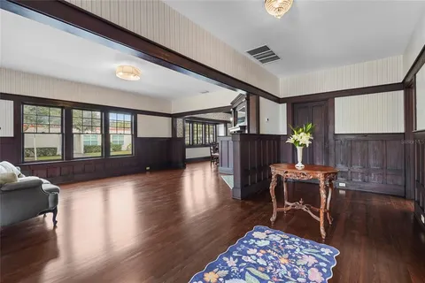 a view of a livingroom with furniture and hardwood floor