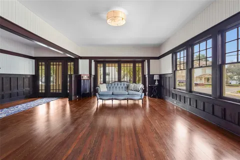 a view of a dining room with furniture window and wooden floor