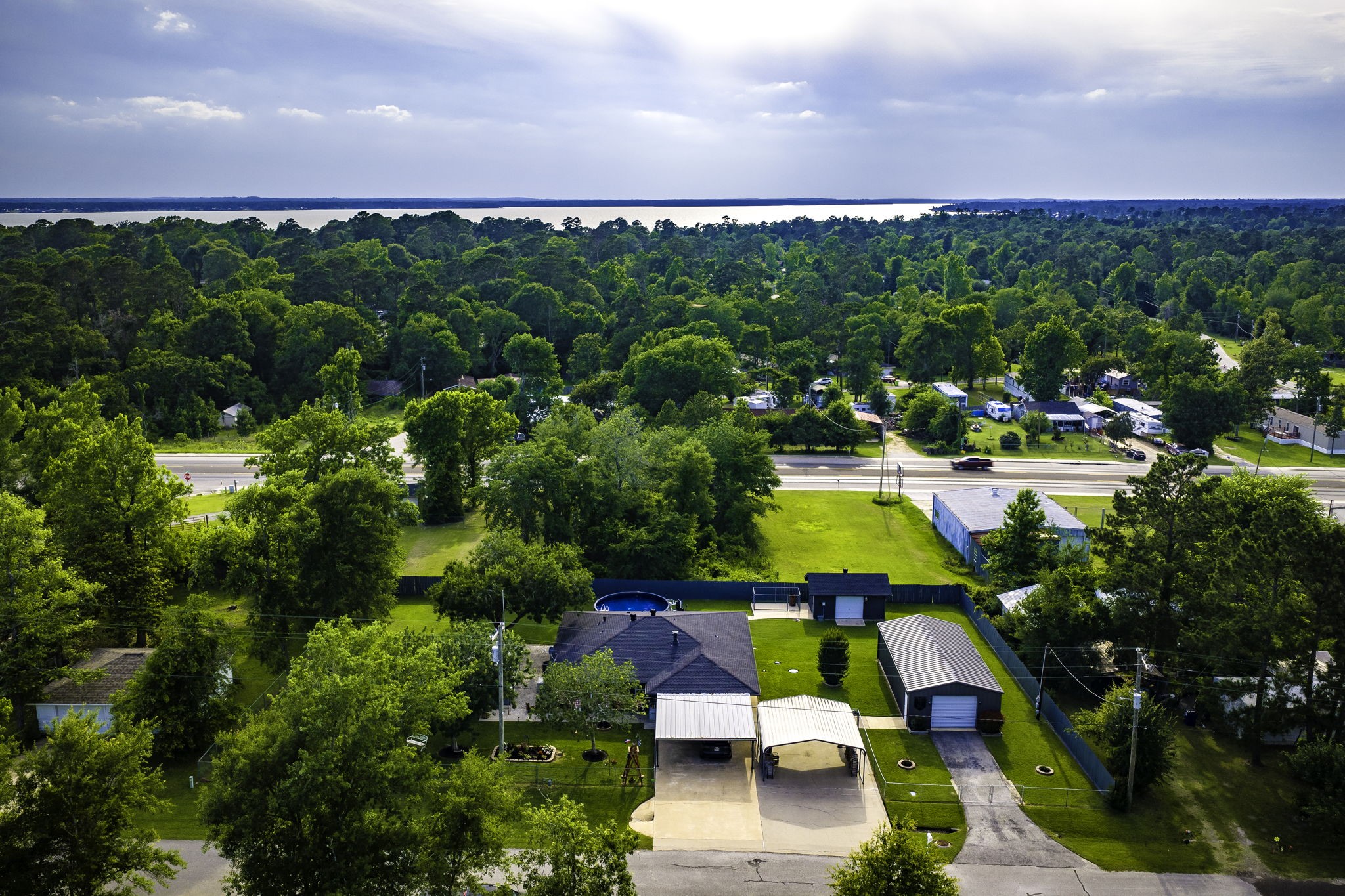 188 Huckleberry Road Onalaska, TX 77360 - Photo 40 of 49 a view of swimming pool outdoor seating and yard