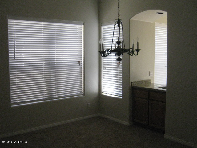 7525 East Gainey Ranch Road, Unit 113 Scottsdale, AZ 85258 - Photo 3 of 5 FORMAL DINING ROOM / BAR