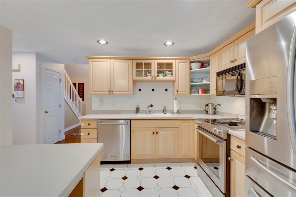 8 Aspen Circle Framingham, MA 01701 - Photo 11 of 31 a kitchen with a sink a stove and cabinets