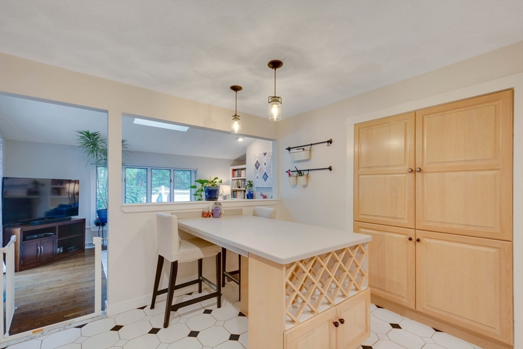 8 Aspen Circle Framingham, MA 01701 - Photo 13 of 31 a open kitchen with white cabinets and stainless steel appliances