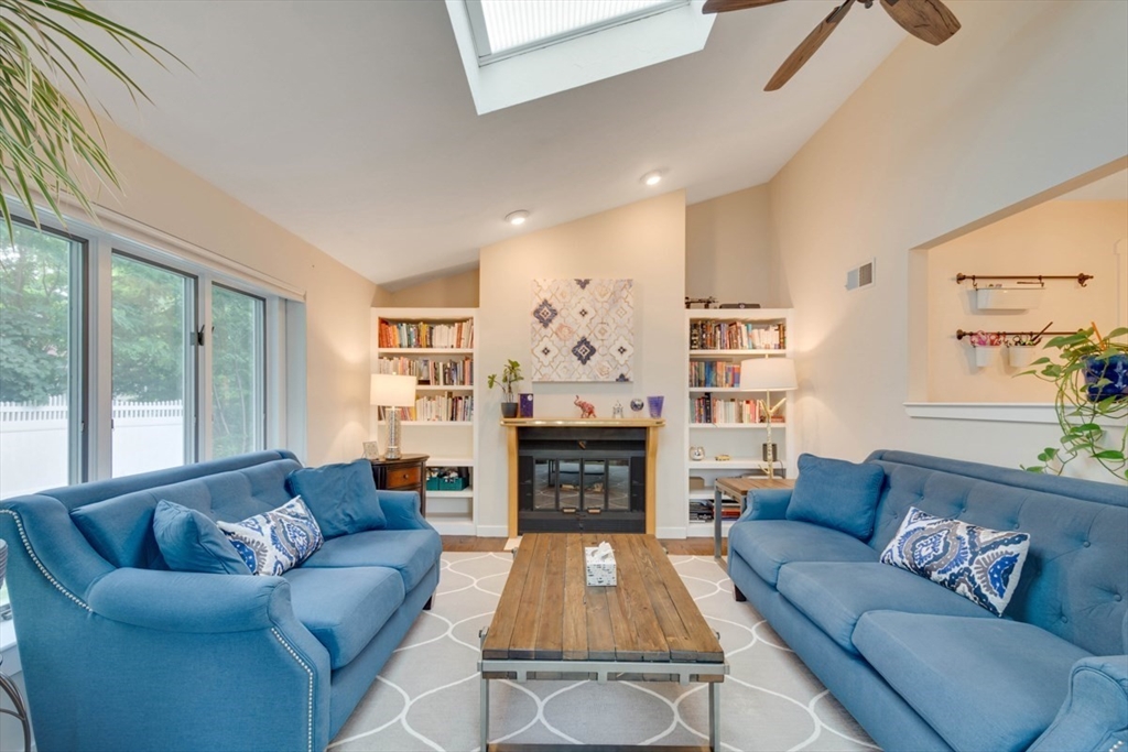 8 Aspen Circle Framingham, MA 01701 - Photo 16 of 31 a living room with furniture fireplace and a large window