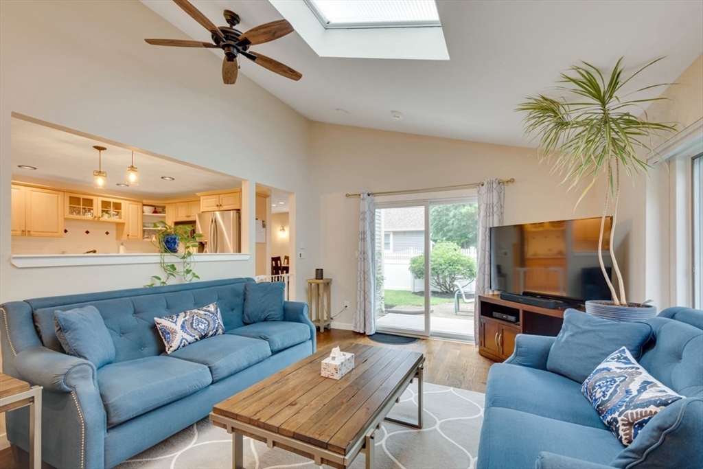 8 Aspen Circle Framingham, MA 01701 - Photo 17 of 31 a living room with furniture and a flat screen tv