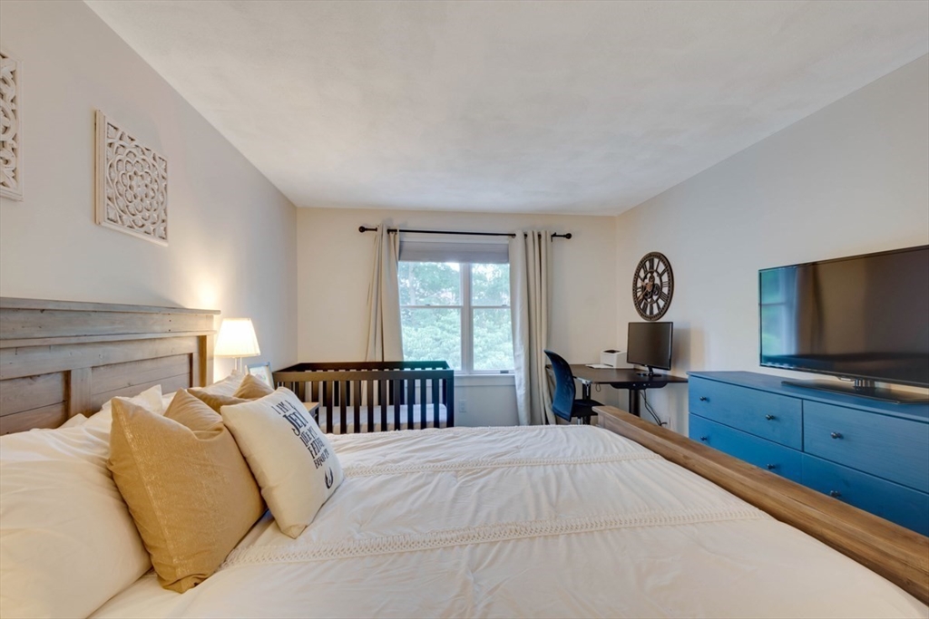8 Aspen Circle Framingham, MA 01701 - Photo 22 of 31 a bedroom with a bed and a flat screen tv