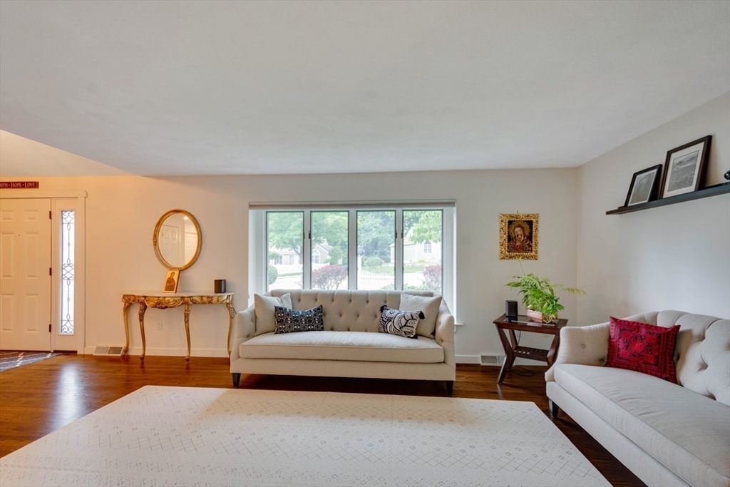 8 Aspen Circle Framingham, MA 01701 - Photo 5 of 31 a living room with furniture and a table