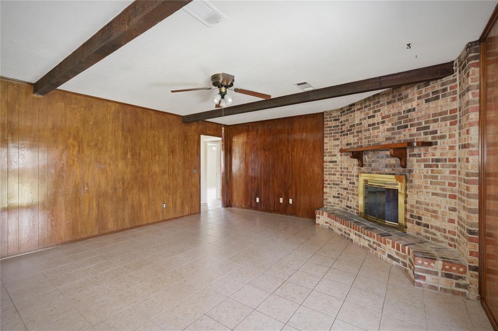 403 Daisy Drive Allen, TX 75013 - Photo 11 of 16 a view of an empty room with a fireplace