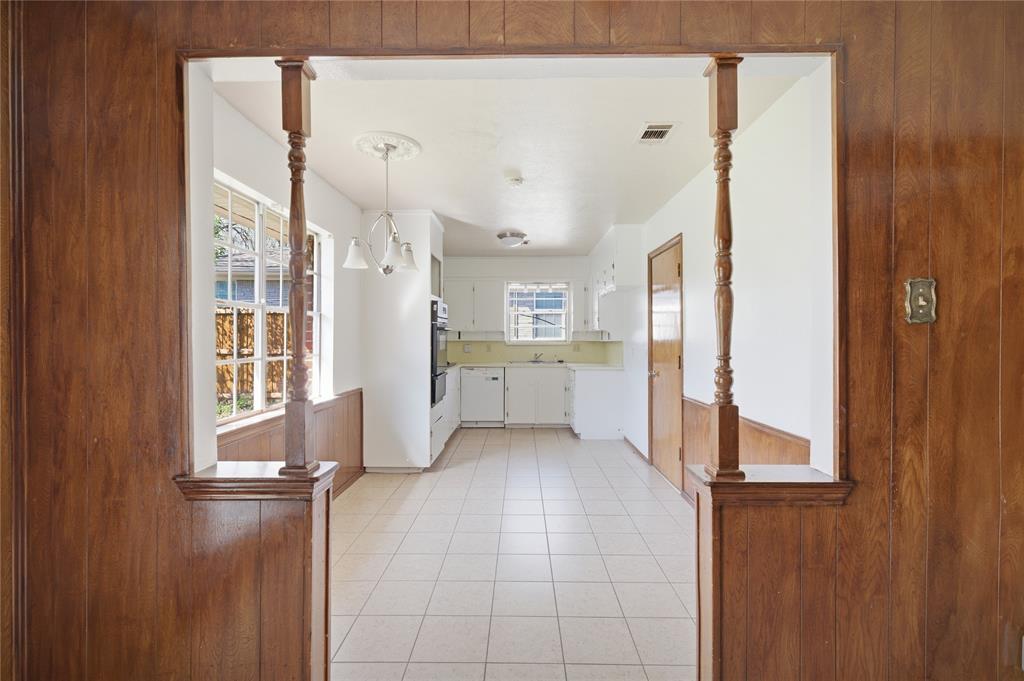 403 Daisy Drive Allen, TX 75013 - Photo 12 of 16 a view of a kitchen with wooden floor and windows