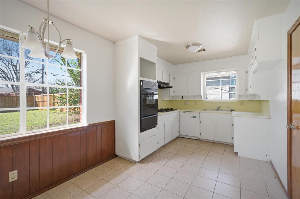 403 Daisy Drive Allen, TX 75013 - Photo 13 of 16 a kitchen with a cabinets and window