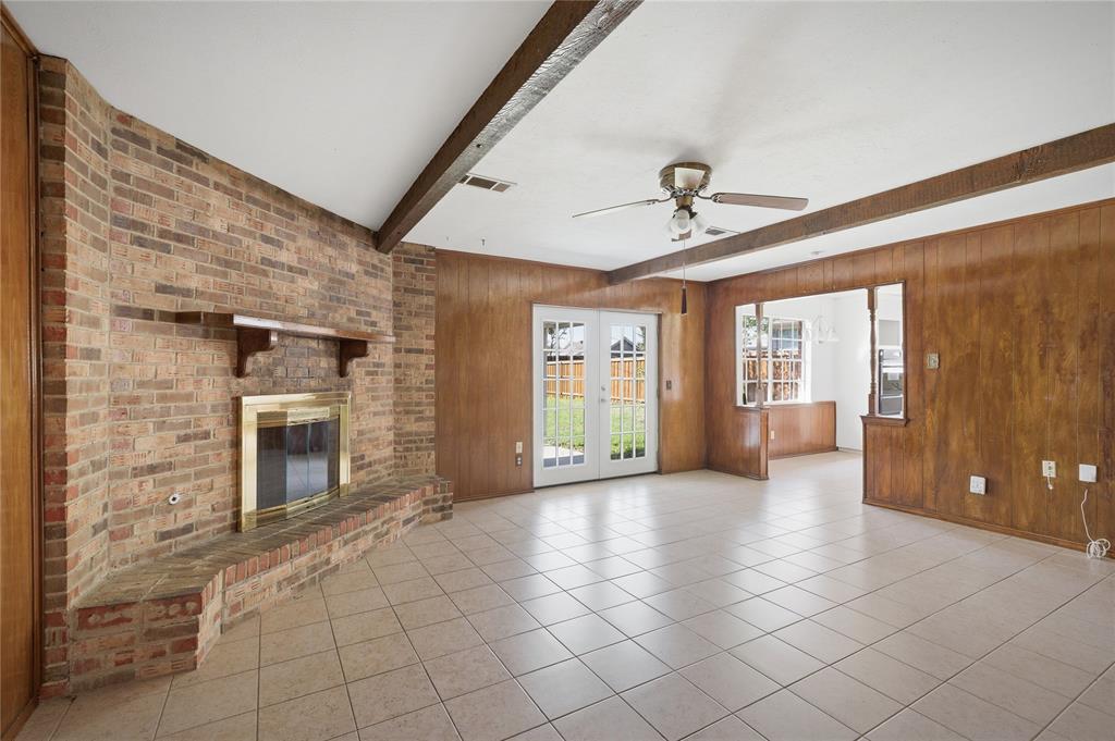 403 Daisy Drive Allen, TX 75013 - Photo 9 of 16 a view of an empty room with a fireplace